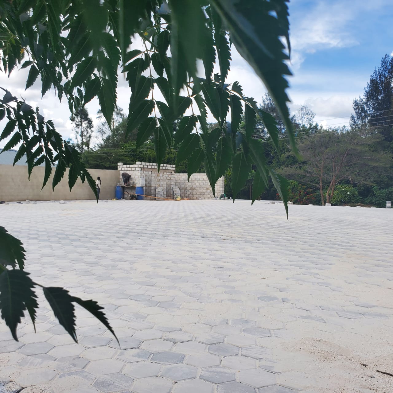 Guardhouse walls being built alongside the completed paving