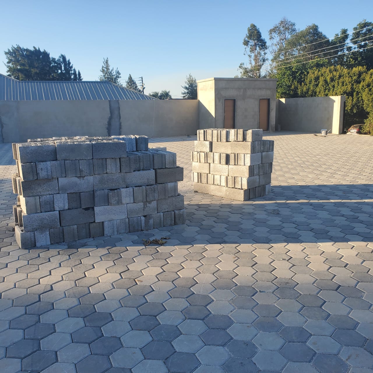 Completed hexagonal block paving across the yard