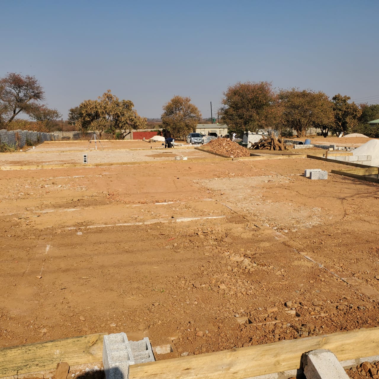 Cleared plot for the semi-detached flats with strip footings set out across the block