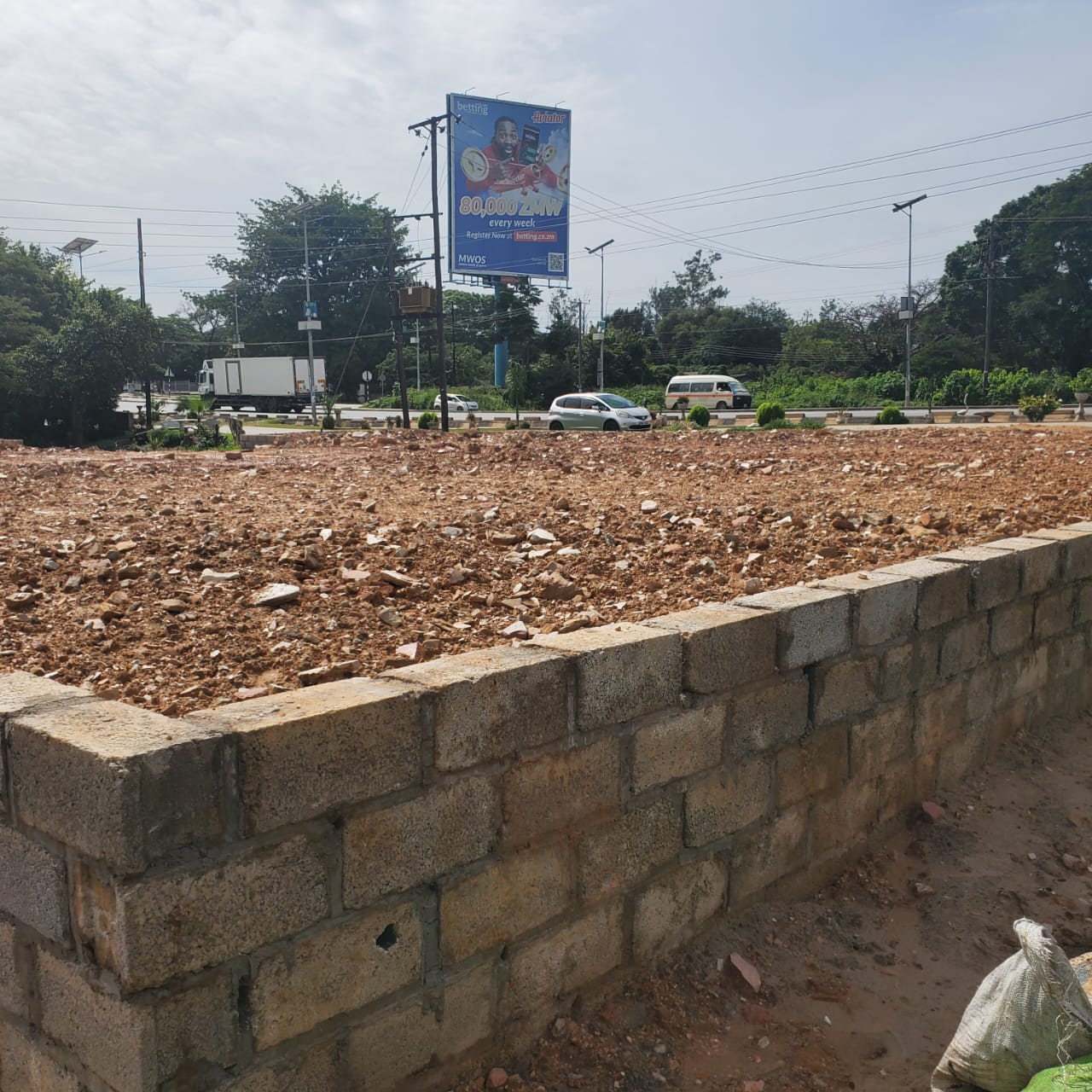 Plot filled and levelled with hardcore, boundary blockwork begun