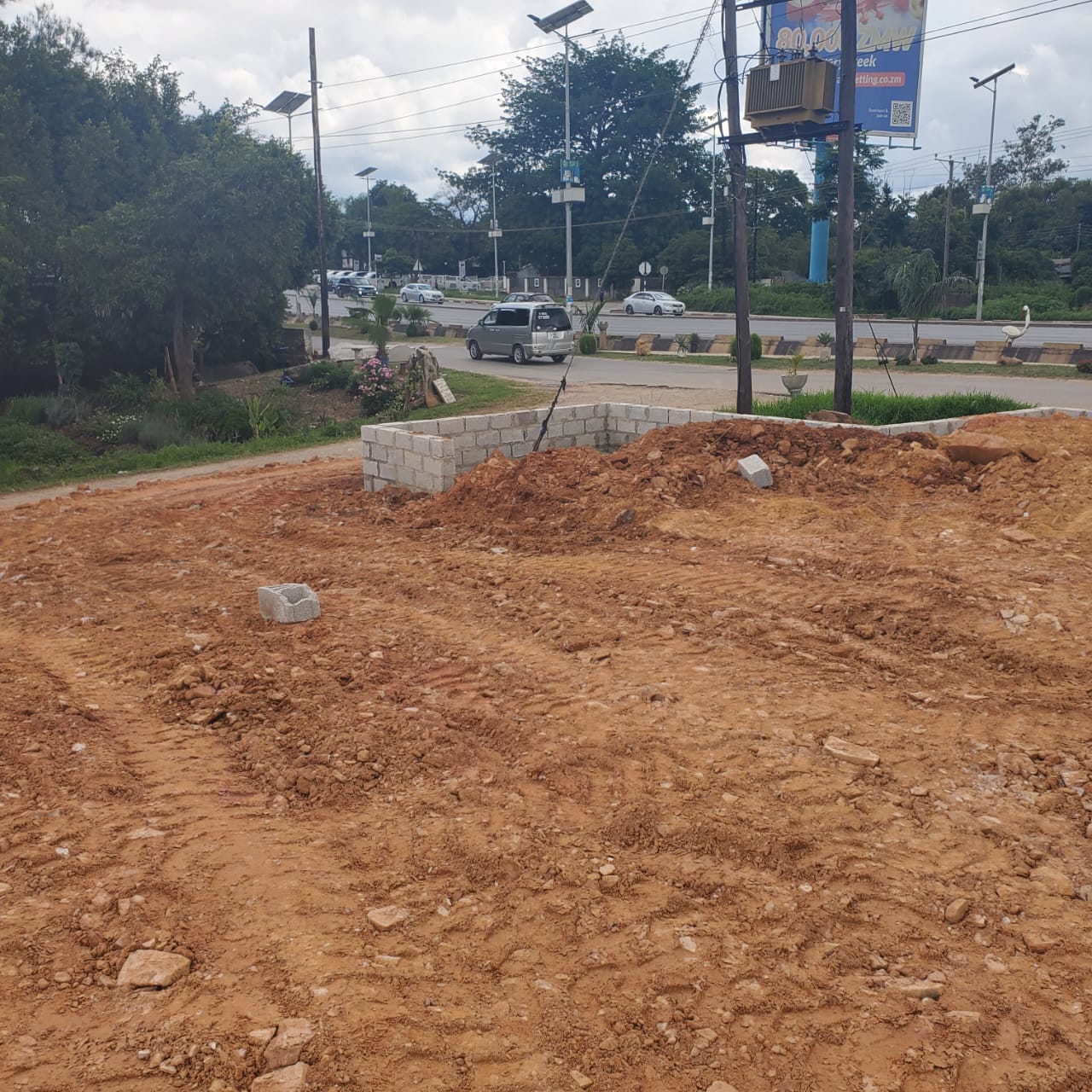 Cut and fill earthworks along the roadside frontage of the plot